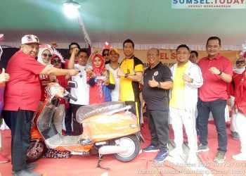 Yanti Humas Koni Kota Palembang Bawa Pulang Doorprize Satu Unit Motor Listrik